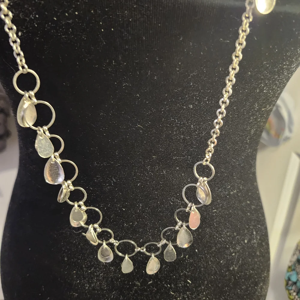 Elegant Silver Necklace with Charms